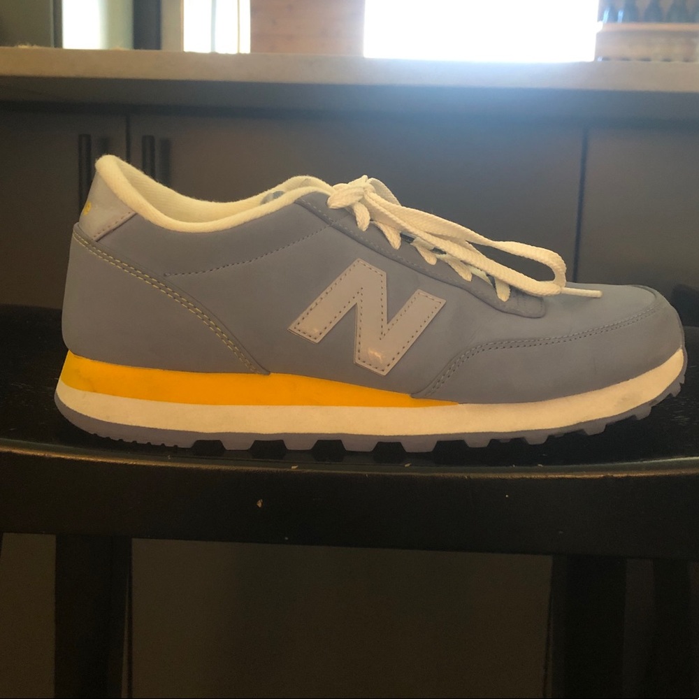 Blue and yellow New Balance sneakers